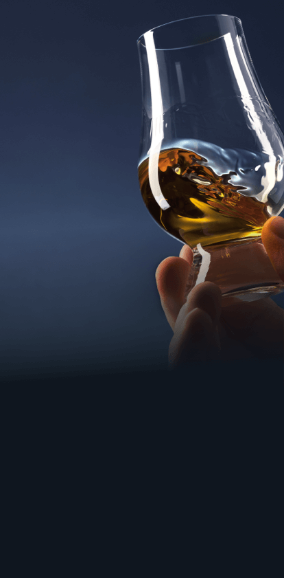Glass of whiskey on hand